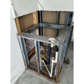 Ace Handyman Services before picture drywall on air handler stand Project in Port St. Lucie, FL