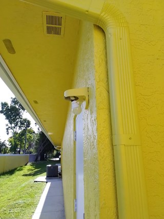 Ace Handyman Services office exterior light fixture before in Port St. Lucie, FL