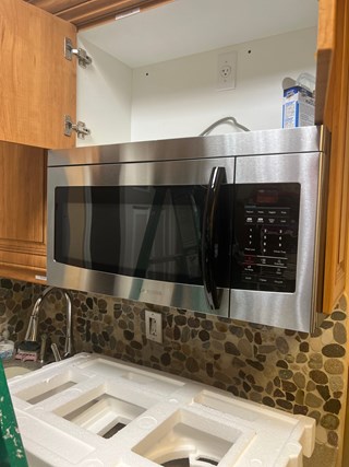 Ace Handyman Services microwave replacement before photo in Port St. Lucie, FL