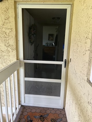 Ace Handyman Services screen door replacement before photo in Port St. Lucie, FL
