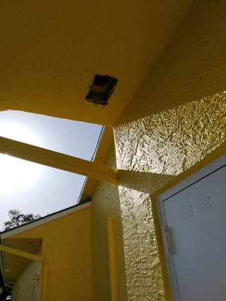 Ace Handyman Services office exterior soffit vent before in Port St. Lucie, FL