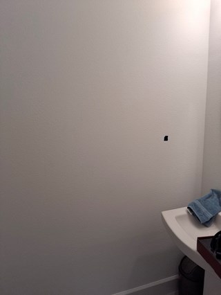 Ace Handyman Services towel rack installation before photo in Port St. Lucie, FL