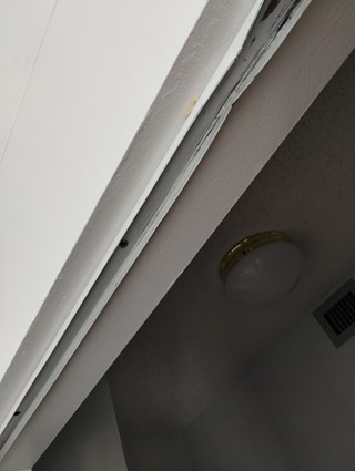 Ace Handyman Services bent closet door track before photo in Port St. Lucie, FL