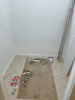 Space-saving closet organizer with shelving and shoe rack in Sarasota