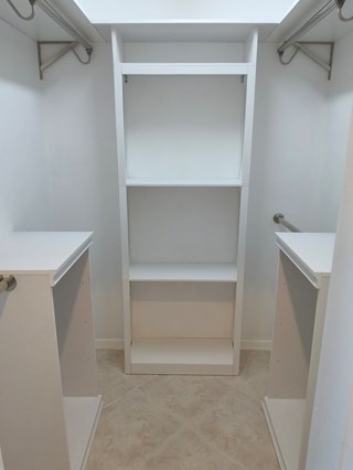 Space-saving closet organizer with shelving and shoe rack in Sarasota