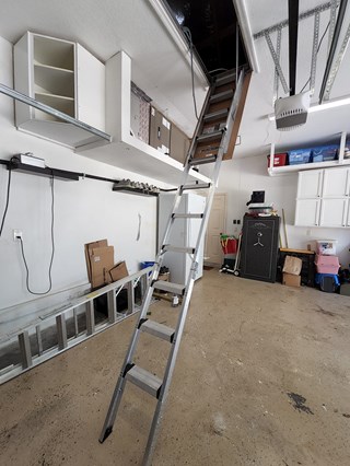 Installation of new attic access ladder in garage