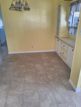 Subfloor, flooring, and baseboard repair work completed