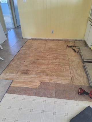 Subflooring, flooring, and baseboard repairs needed