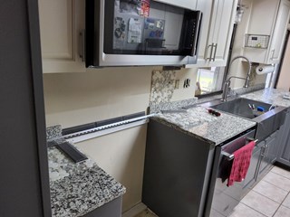 Kitchen before installation of tile backsplash
