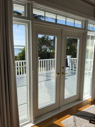 French doors before plantation shutter installation 