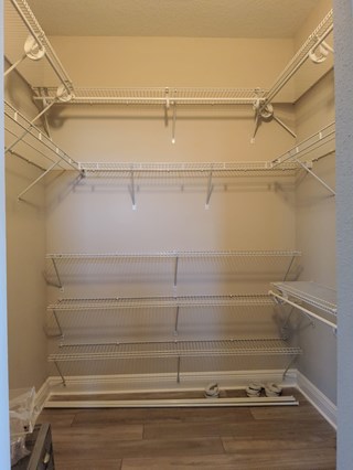 Custom installation of wire shelving inside closet