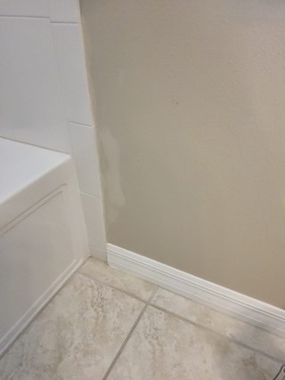 Small tile repair in bathroom after