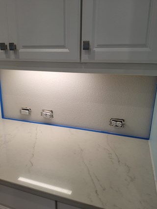 Kitchen wall before installation of backsplash