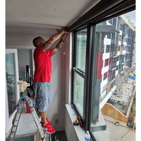 Installing a sun shade on Siesta Key