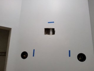 Drywall hole in wall during bathroom remodel