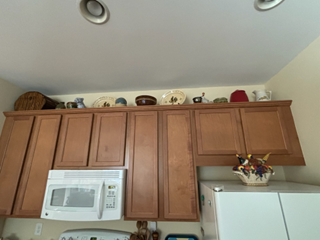 Open space above cabinets that customer wanted filled