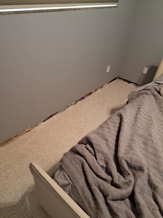 Bedroom wall repair with baseboards removed Tampa Florida