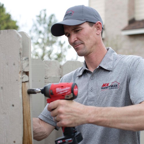 Handyman Repairing Fence Handyman Repairing Fence