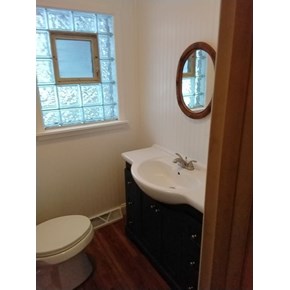 Ace Handyman Services of Lincoln Way did a bathroom refresh, including flooring, vanity, beadboard, wainscoting