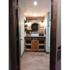 Ace Handyman Services of Lincoln Way built custom cabinet, shelves and a barn door 