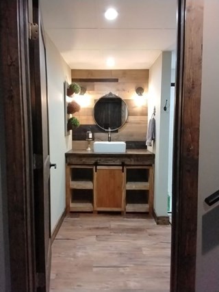 Ace Handyman Services of Lincoln Way built custom cabinet, shelves and a barn door after