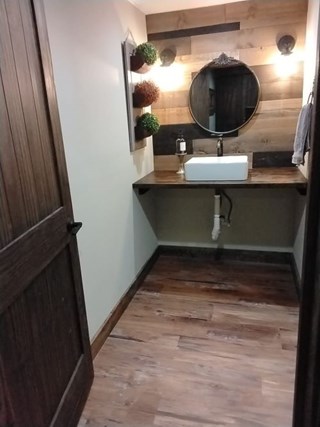 Ace Handyman Services of Lincoln Way built custom cabinet, shelves and a barn door before