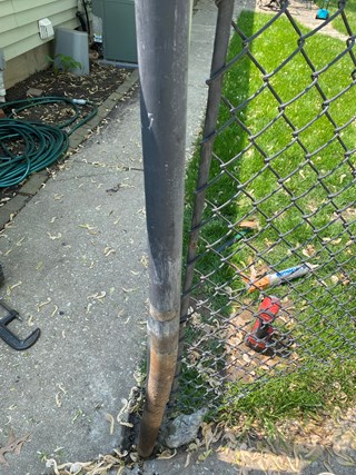 Ace Handyman Services repaired a chain link fence post that was bent