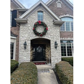 Ace Handyman Services of Lincoln Way drilled in the masonry and hung a wreath 
