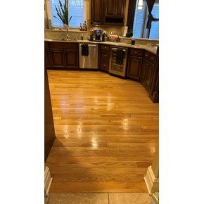 Ace Handyman Services of Lincoln Way repaired and stained flooring to match existing in a kitchen 