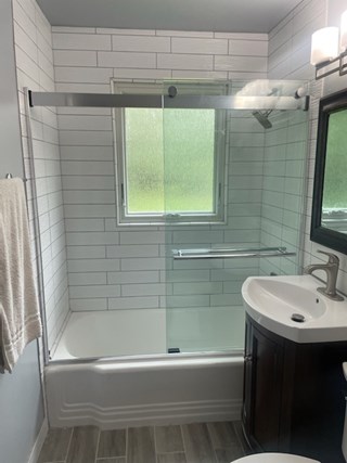 Ace Handyman Services of Lincoln Way installed glass shower doors after