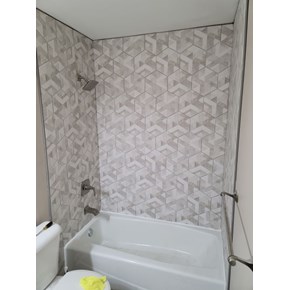 Ace Handyman Services of Lincoln Way replaced the shower tub surround, extending it to the ceiling and installed new fixtures