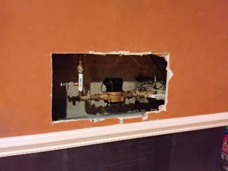 Ace Handyman Services of Lincoln Way repaired drywall, installed access panel and painted to match before