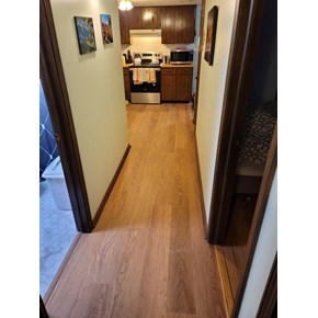 Ace Handyman Services of Lincoln Way replaced flooring in a hallway and kitchen area