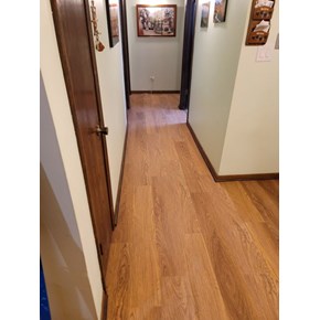 Ace Handyman Services of Lincoln Way replaced flooring in a hallway and kitchen area