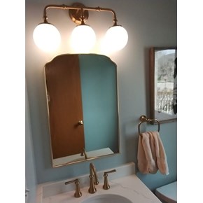 Ace Handyman Services of Lincoln Way moved a light up, patched and painted the drywall and hung a mirror