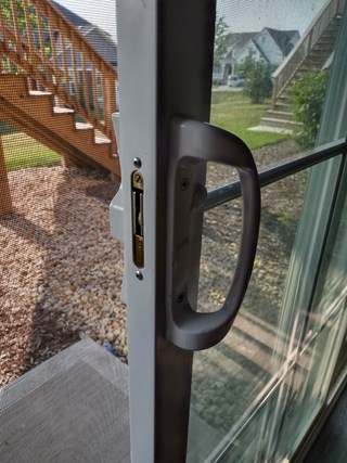 Ace Handyman Services of Lincoln Way replaced a latch on a sliding patio door to a key lock handle before