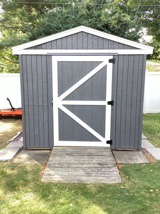 Custom shed door installation and paint in Cedar Rapids, IA