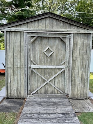 Custom shed door installation and paint in Cedar Rapids, IA