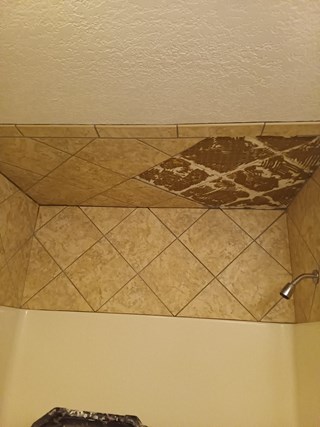 AHS Des Moines East Shower Tile Repair before 