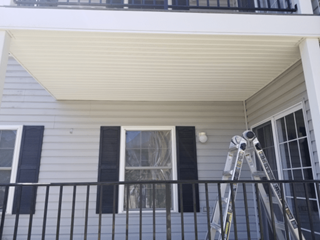 Installing Soffit under a deck in Sykesville, MD after