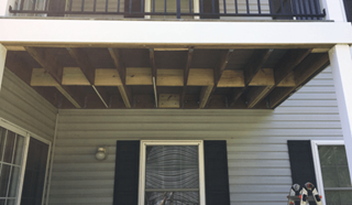 Installing Soffit under a deck in Sykesville, MD before