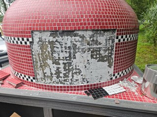 Before- Replace missing tiles on pizza oven in Severn, MD- Ace Handyman Services Laurel