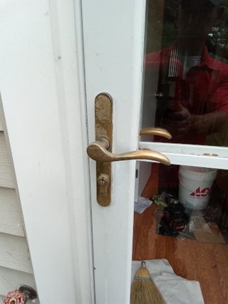 Before- Storm door handle replacement in Crofton, MD- Ace Handyman Services Laurel