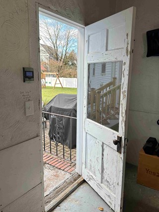 The "people" door in this Winchester garage needed updating.