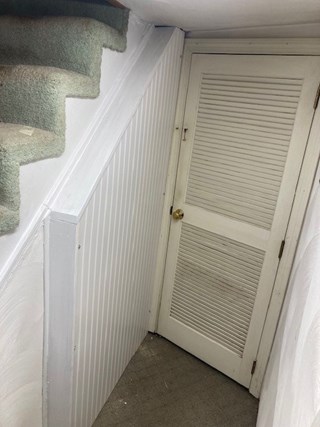 Our Craftsman famed the area and install beadboard paneling for a finished look.