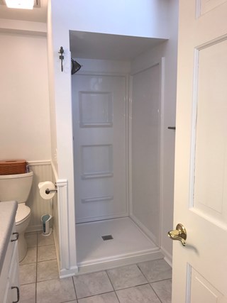 Bathroom refreshed:  Installed shower, drywall, tile, paint, toilet, & vanity in this basement bathroom in Cascade Michigan.