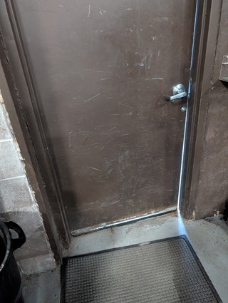 Commercial Door Repair Before in Traverse City