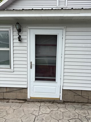 Door Repair Before in Traverse City