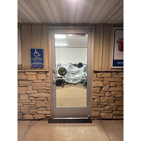 New exterior door installation at a retail store in Albertville