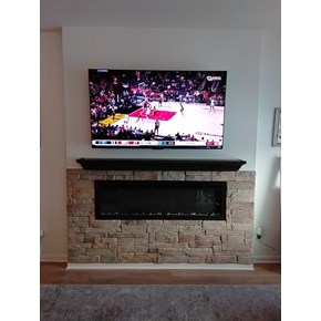 Fireplace mantel and faux brick installation in Maple Grove 